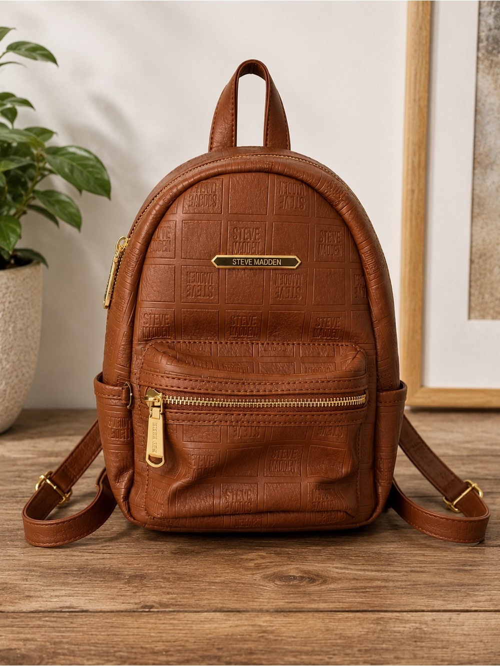 Steve Madden Brown Mini Backpack Embossed Logo Gold Tone Zipper Adjustable Strap